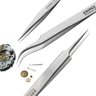 Nahaufnahme einer Uhrmacher-Arbeitsfläche mit geöffnetem Uhrwerk und verschiedenen Pinzetten und Werkzeugen zur Reparatur.