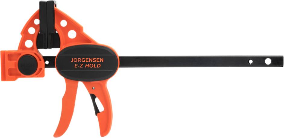 Eine orange-schwarze Einhandzwinge mit der Aufschrift 'Jorgensen E-Z Hold', verwendet zum Festhalten von Werkstücken in der Holzverarbeitung.