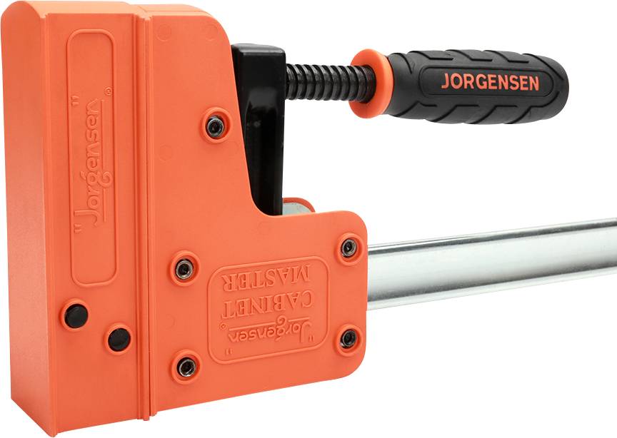 Eine orange Zwinge mit schwarzem Griff und der Aufschrift 'JORGENSEN'. Sie dient zum Fixieren von Werkstücken beim Arbeiten.