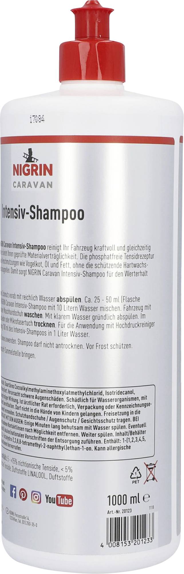 Flasche Nigrin Caravan Intensiv-Shampoo, 1000 ml. Reinigt Fahrzeuge kraftvoll. Rote Kappe, weißes Etikett mit Anwendungshinweisen.