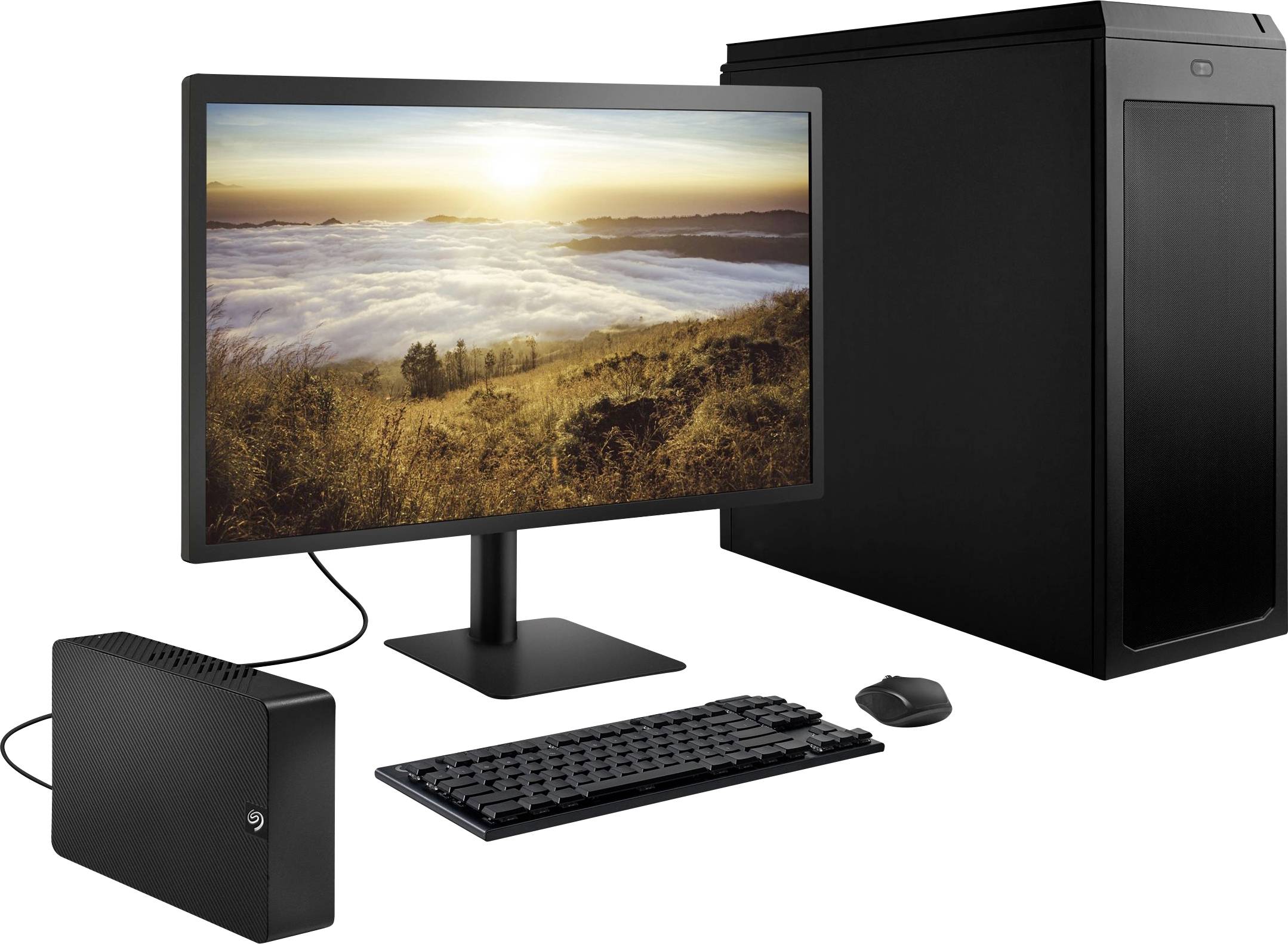 Ein Desktop-Computer-Setup mit Monitor, der eine Landschaft mit wolkenbedecktem Himmel zeigt, dazu Tastatur, Maus und externes Laufwerk.