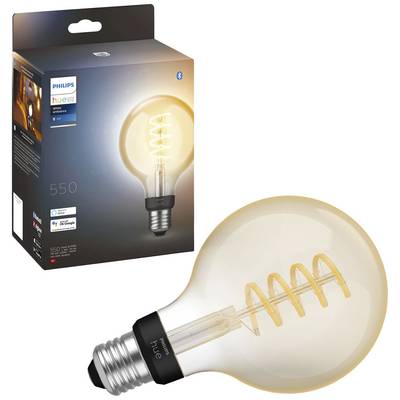 Glühbirne vor Verpackung mit leuchtendem Filament im Spiralmuster. Verpackung zeigt Markenname und Lichtintensität '550 Lumen'.