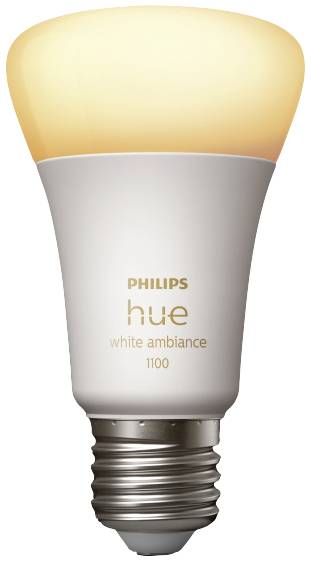 Eine smarte Glühbirne von Philips Hue, Modell White Ambiance 1100, emittiert warmes Licht und ist zur intelligenten Beleuchtungssteuerung geeignet.