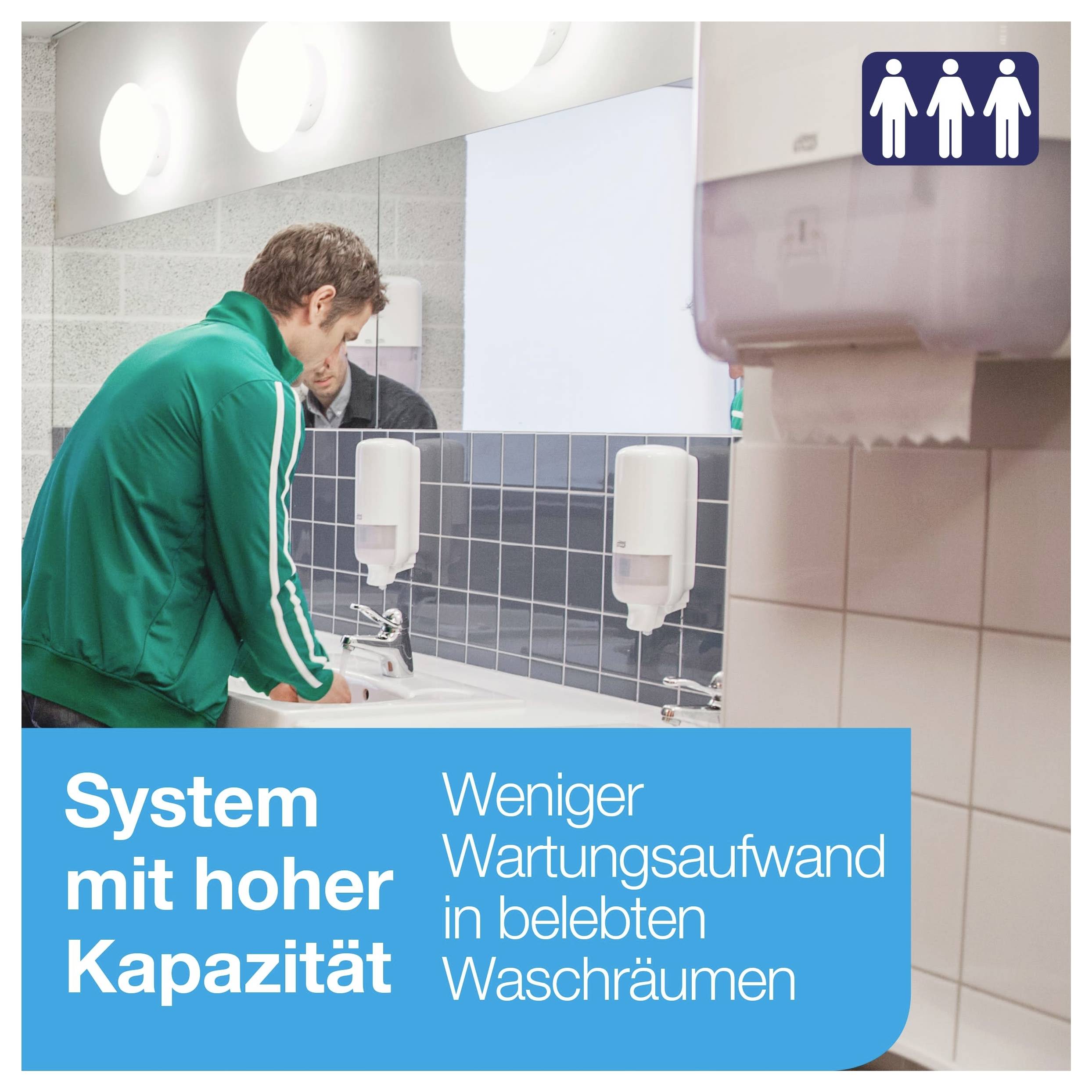 Mann wäscht sich am Waschbecken im öffentlichen Waschraum; Hinweistext: 'System mit hoher Kapazität', 'Weniger Wartungsaufwand in belebten Waschräumen'.