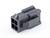 Ein schwarzer Kunststoffstecker mit vier quadratischen Öffnungen, geeignet für elektronische Verbindungen, auf weißem Hintergrund.