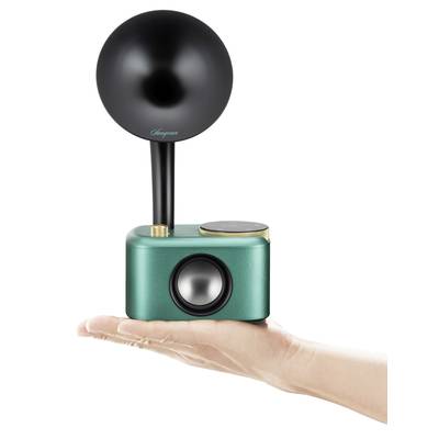 Eine Hand hält einen Retro-Lautsprecher mit einem grünen Gehäuse und einem schwarzen, kugelförmigen Horn oben.