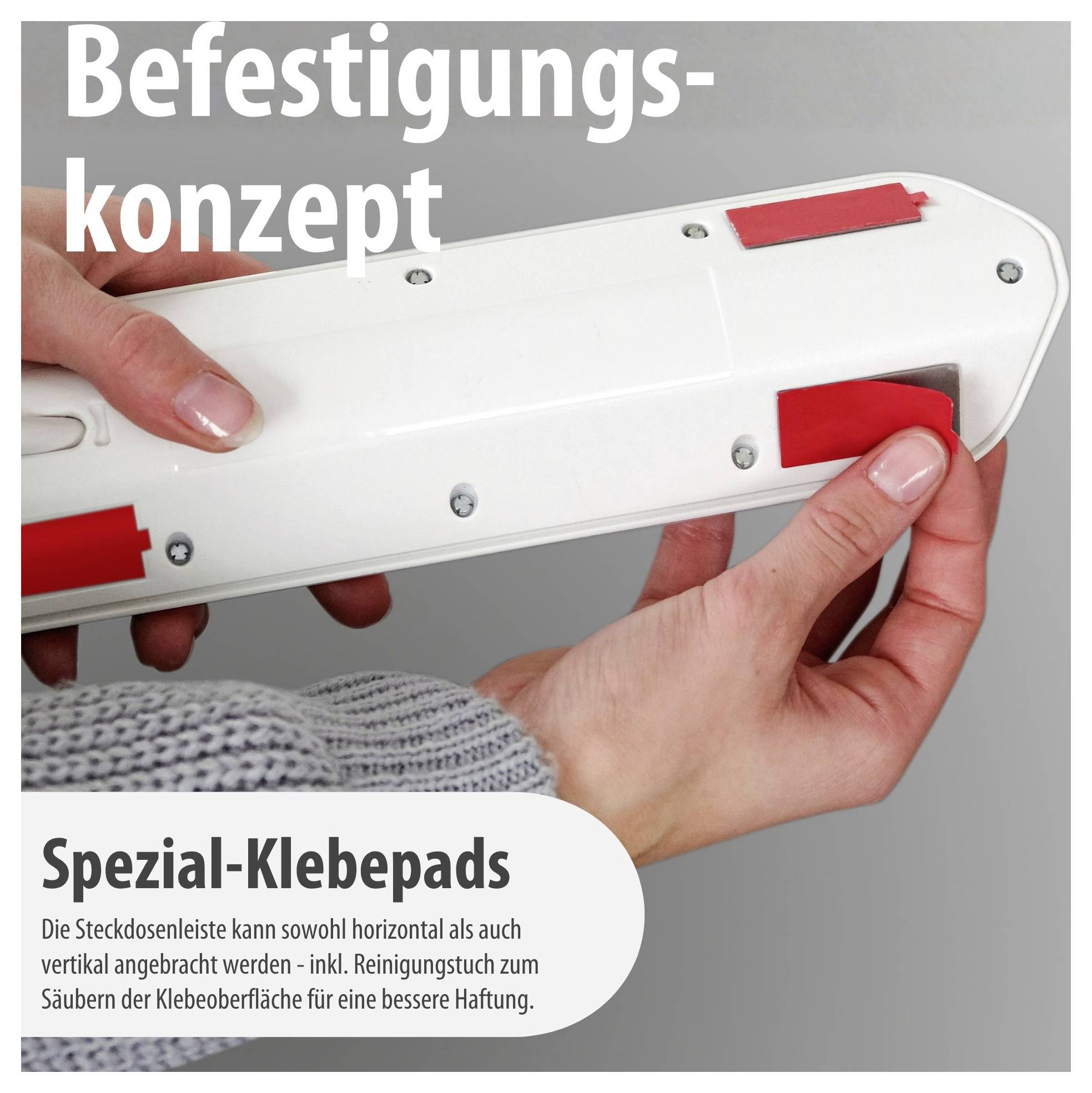 Illustration einer Steckdosenleiste mit roten Spezial-Klebepads; Text nennt ein Befestigungskonzept für horizontale oder vertikale Montage mit Reinigungstuch.