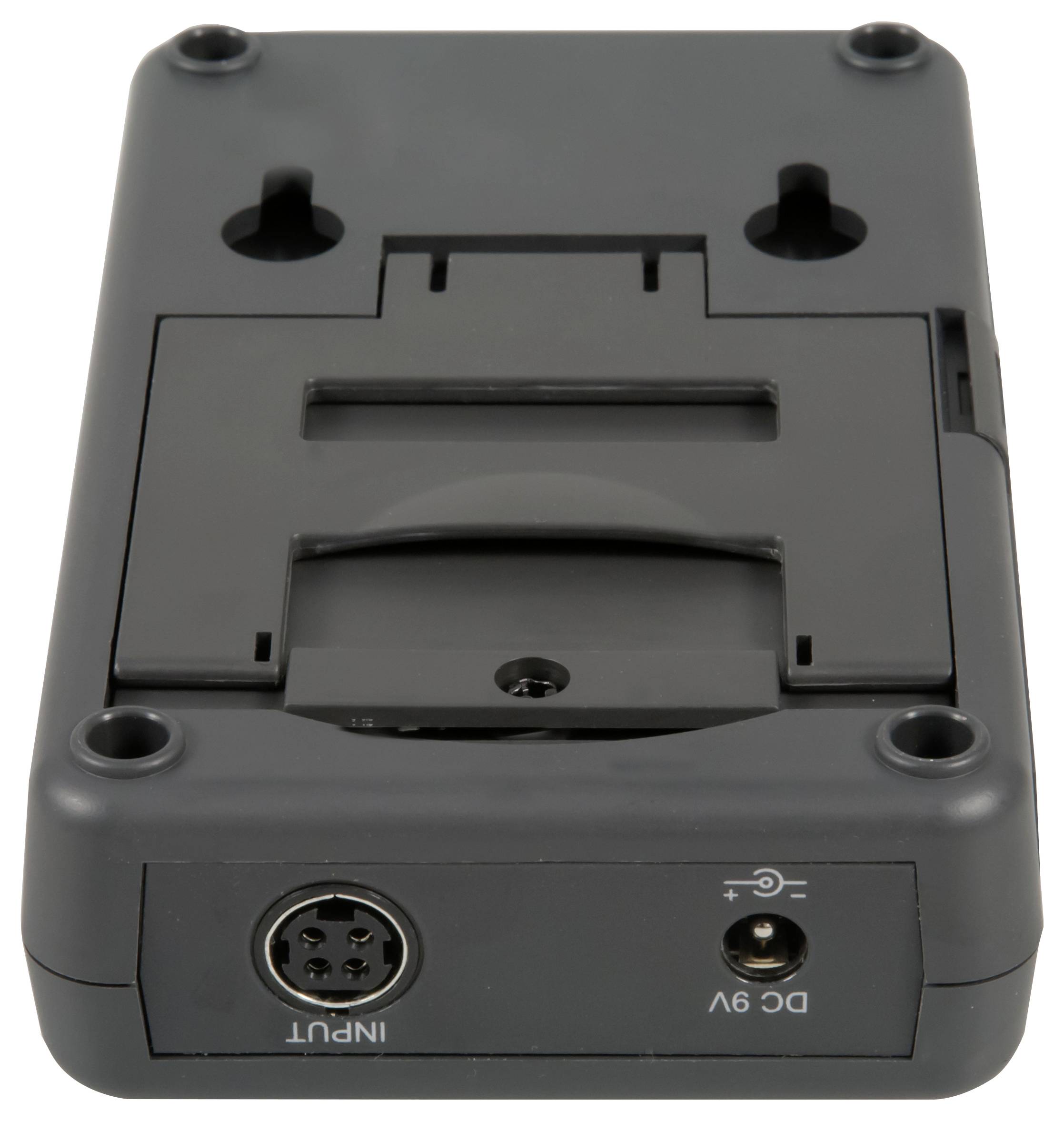 Schwarzes elektronisches Gerätedocking/Adapter mit Montagelöchern, rundem INPUT-Anschluss und DC-9V-Stromanschluss auf weißem Hintergrund.