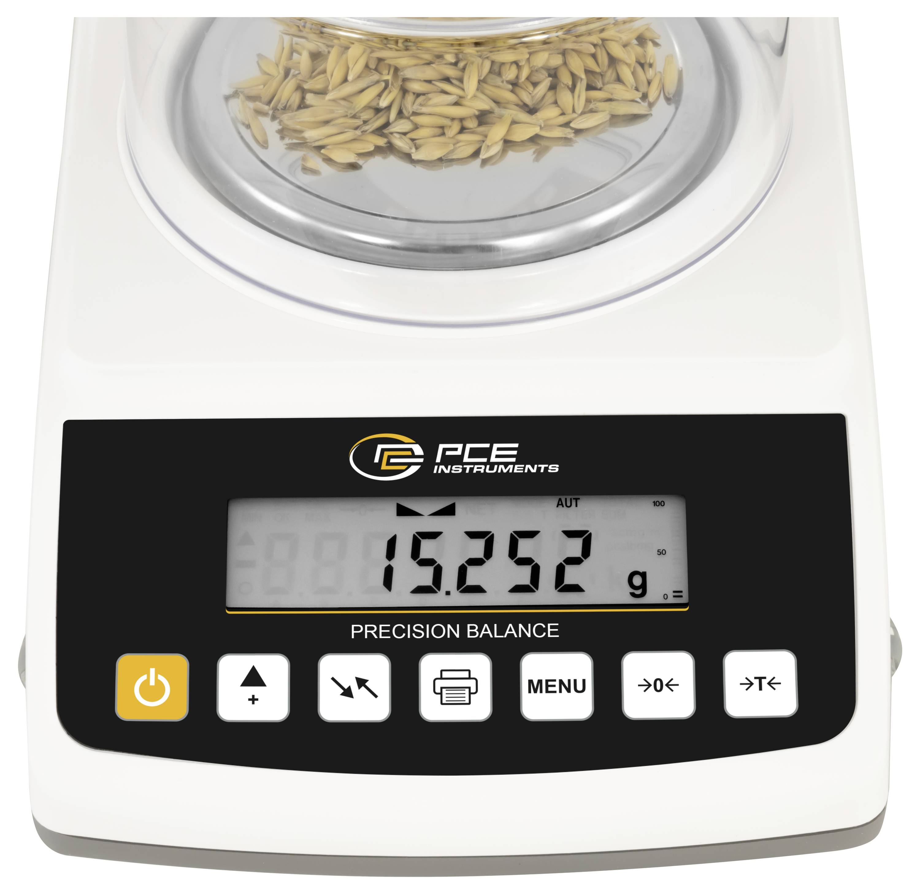 Präzisionswaage zeigt 15,252 g mit einer Getreidprobe auf der Wiegeplattform an.
