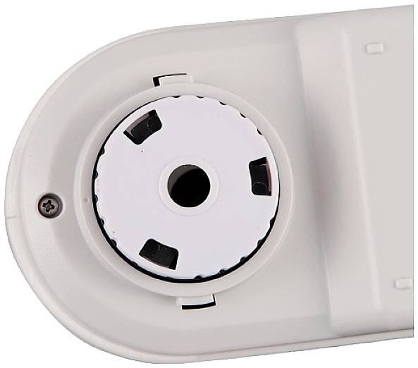 Weißes Gerät mit einem runden, gezahnten Drehknopf in der Mitte, umgeben von einem ovalen Gehäuse.