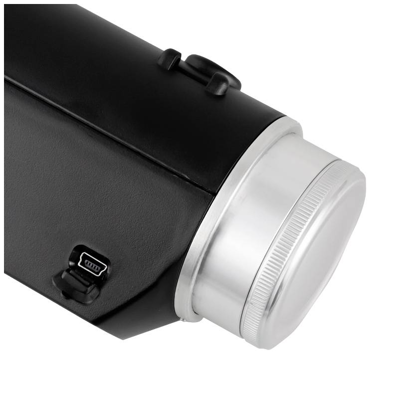 Ein schwarzer Zylinder mit einem silbernen Deckel und einem kleinen Anschluss auf der Seite, möglicherweise ein Teil eines Geräts.