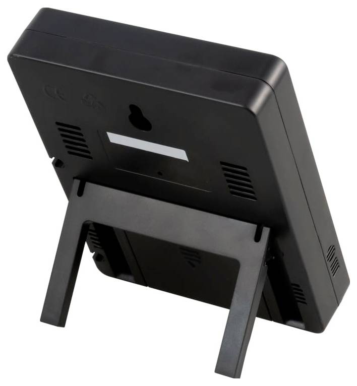 Schwarzes rechteckiges elektronisches Gerät, von hinten gezeigt, mit Lüftungsschlitzen, Wandbefestigungsloch und ausklappbarem Ständer oder Beinen.