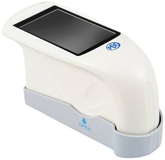 Ein weißes, tragbares Gerät auf einer grauen Basis mit einem kleinen Display oben. Ein blauer Pfeil zeigt auf 'OPEN' auf der Basis.