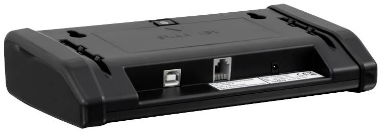Unterseite eines schwarzen elektronischen Geräts mit USB- und Netzwerkschnittstellen.
