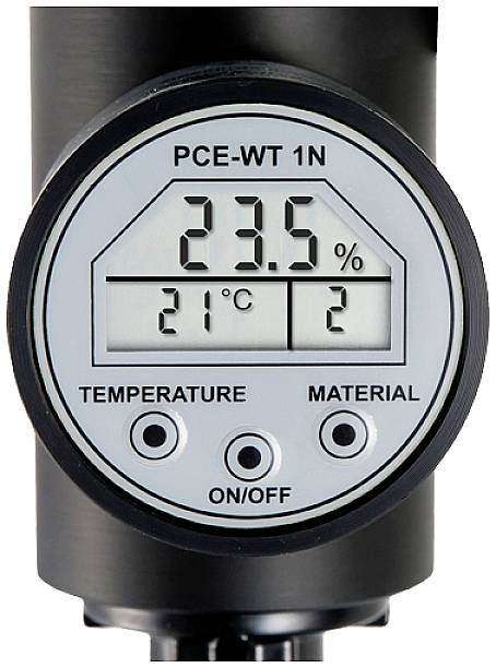 Messgerät mit digitalem Display zeigt '23,5%'. Darunter '21°C' und '2'. Beschriftungen: 'TEMPERATURE', 'MATERIAL', 'ON/OFF'.