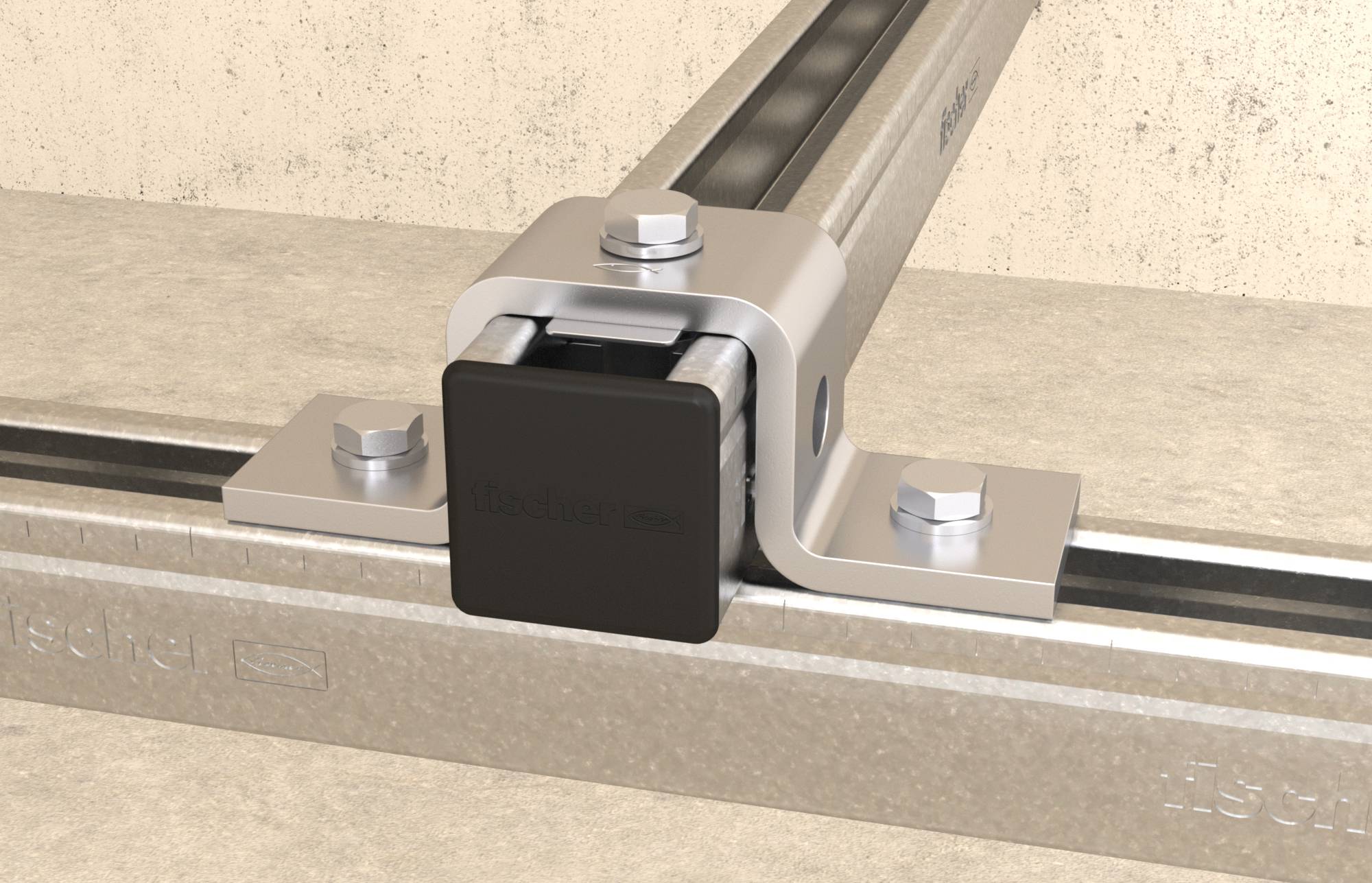 Metallschiene mit schwarzem Endstück, befestigt auf einem Betonboden mit Metallklammern und Schrauben.