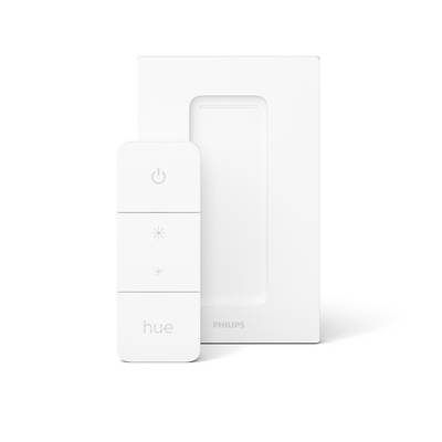 Ein weißer Philips Hue Dimmschalter vor einer weißen, rechteckigen Abdeckung. Der Schalter hat drei Tasten für Steuerung und Dimmung.