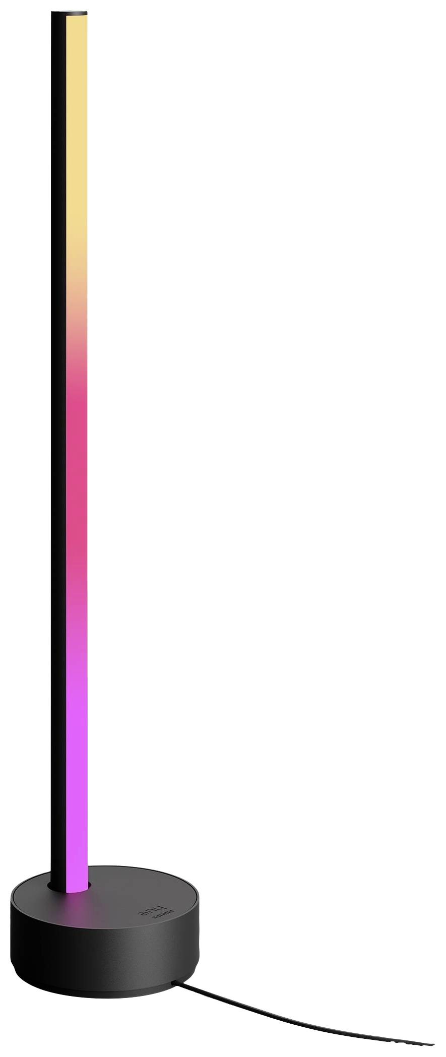 Eine schmale, stehende LED-Lampe mit farbveränderbarem Lichtstrahl auf einem runden, schwarzen Sockel.
