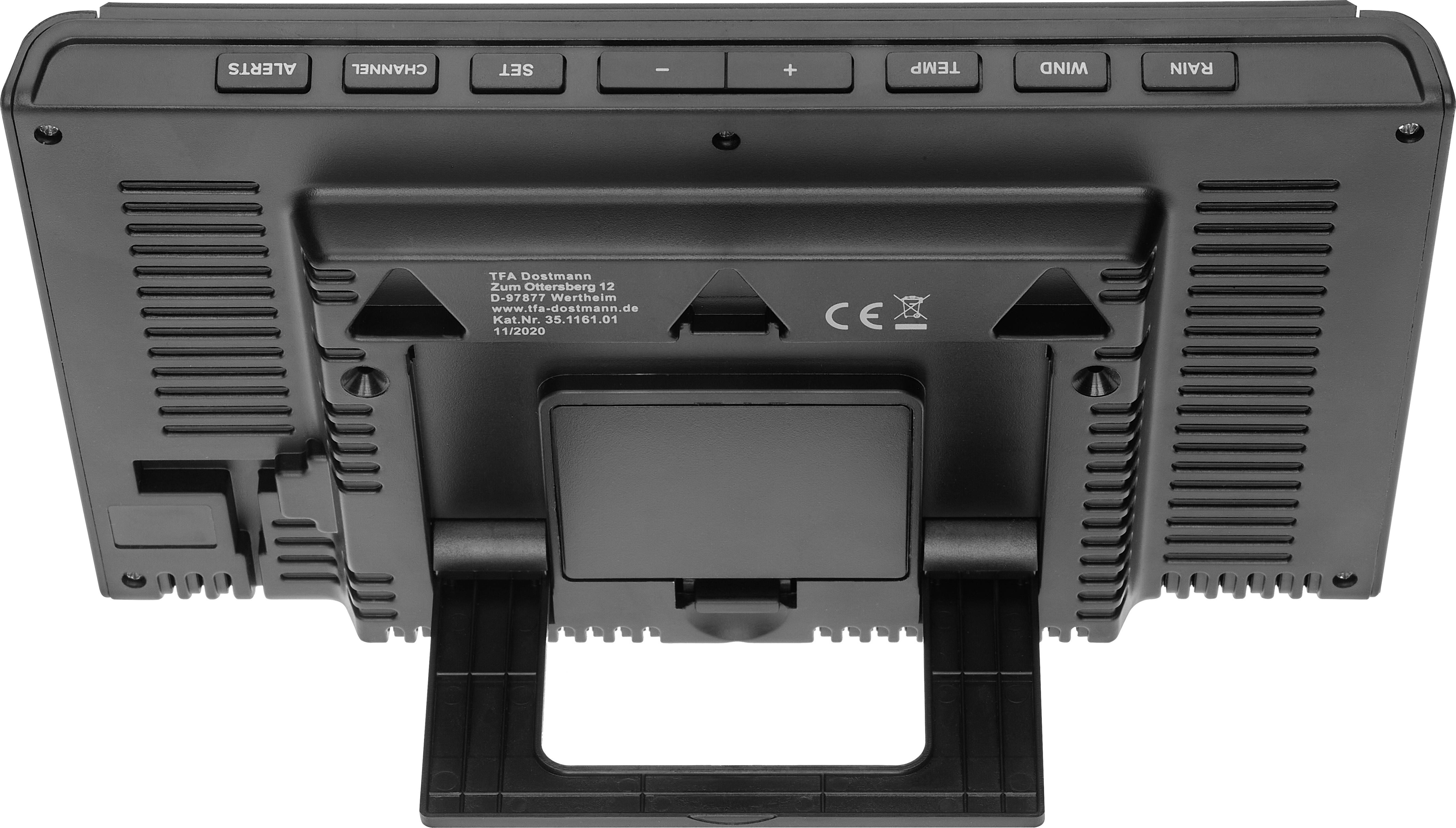 Schwarzes elektronisches Gerät von hinten, zeigt Bedienelemente wie Kanal-, Set- und Scan-Tasten. Gerät steht auf einem ausklappbaren Ständer.