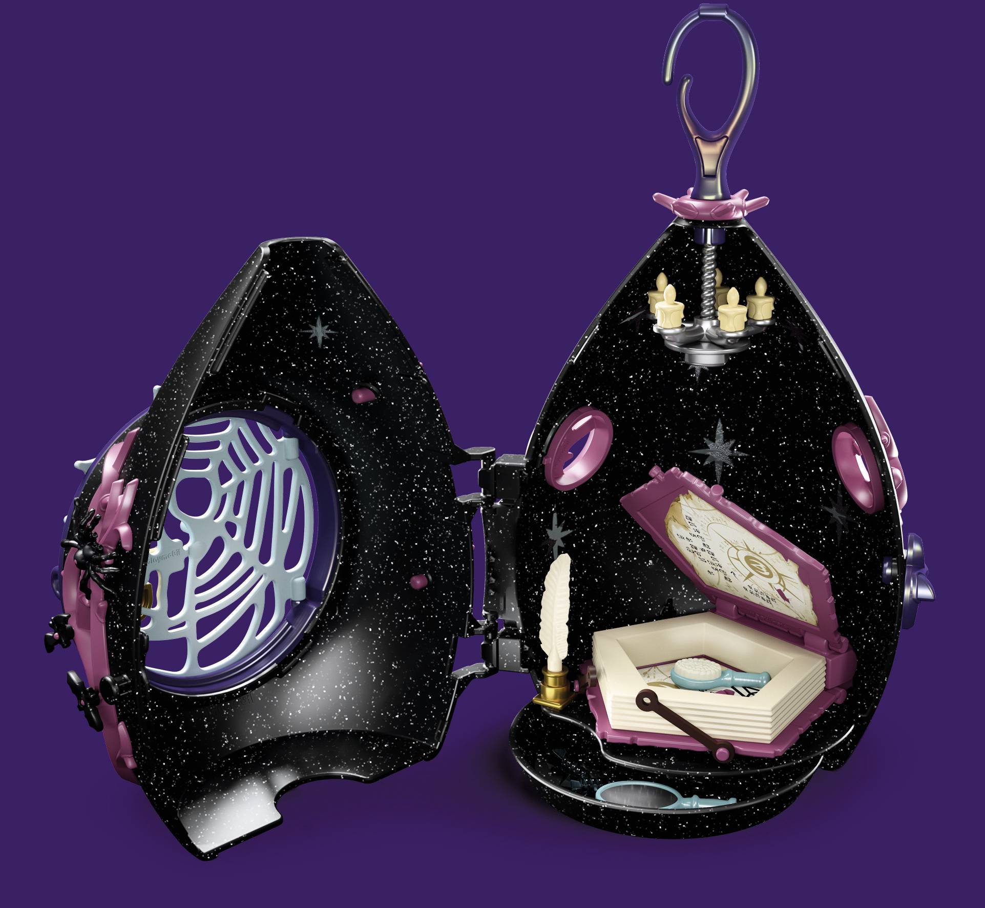 Spielzeug-Ei in Schwarz mit glitzernden Details, offen und zeigt eine magische Szenerie im Inneren mit kleinen Accessoires.
