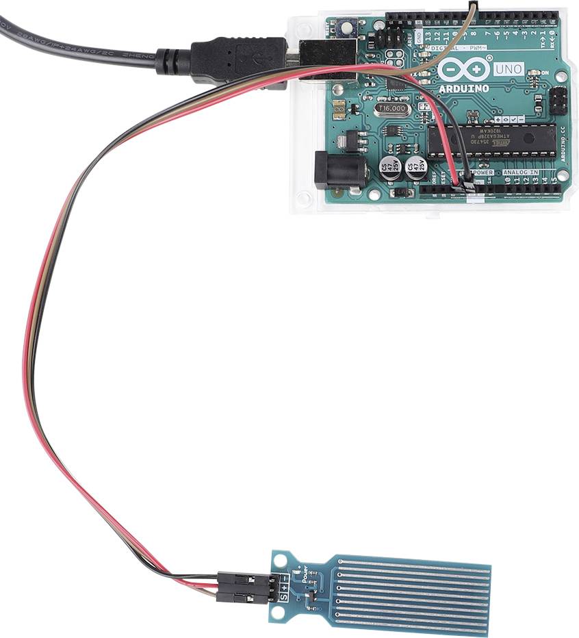 Ein Arduino-Board mit angeschlossenem Feuchtigkeitssensor. Das Board ist über USB-Kabel mit einer Stromquelle verbunden.