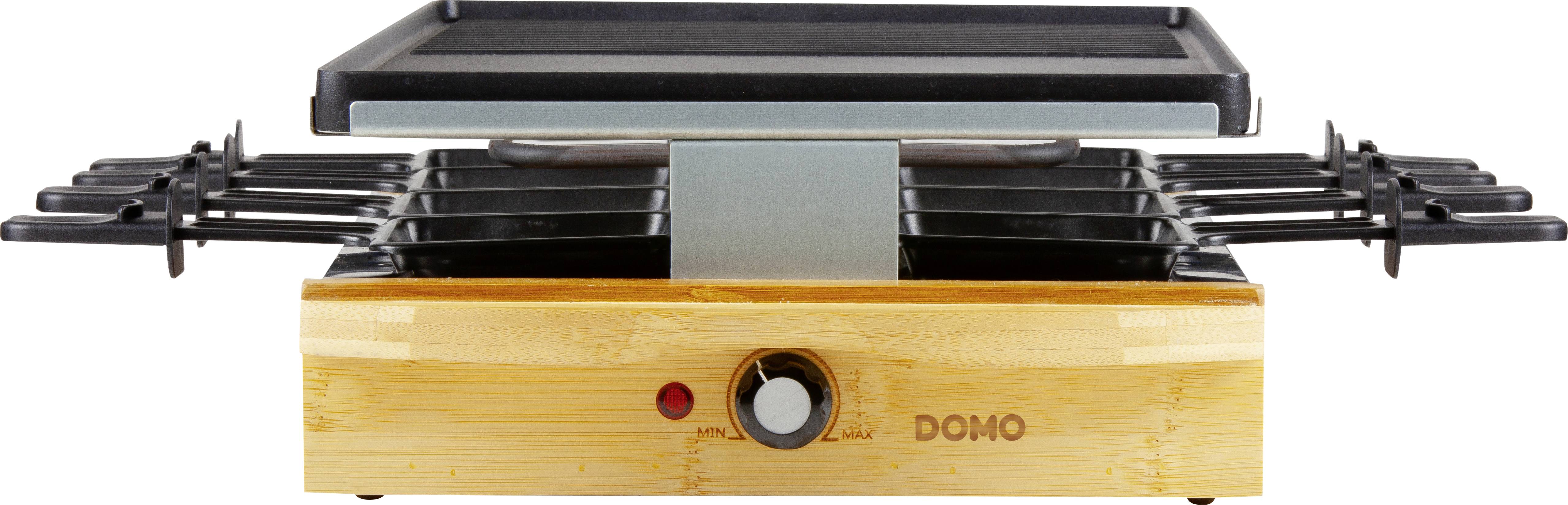 Ein elektrischer Raclette-Grill mit Holzoptik, mehreren Pfännchenfächern und einem Temperaturregler an der Vorderseite.