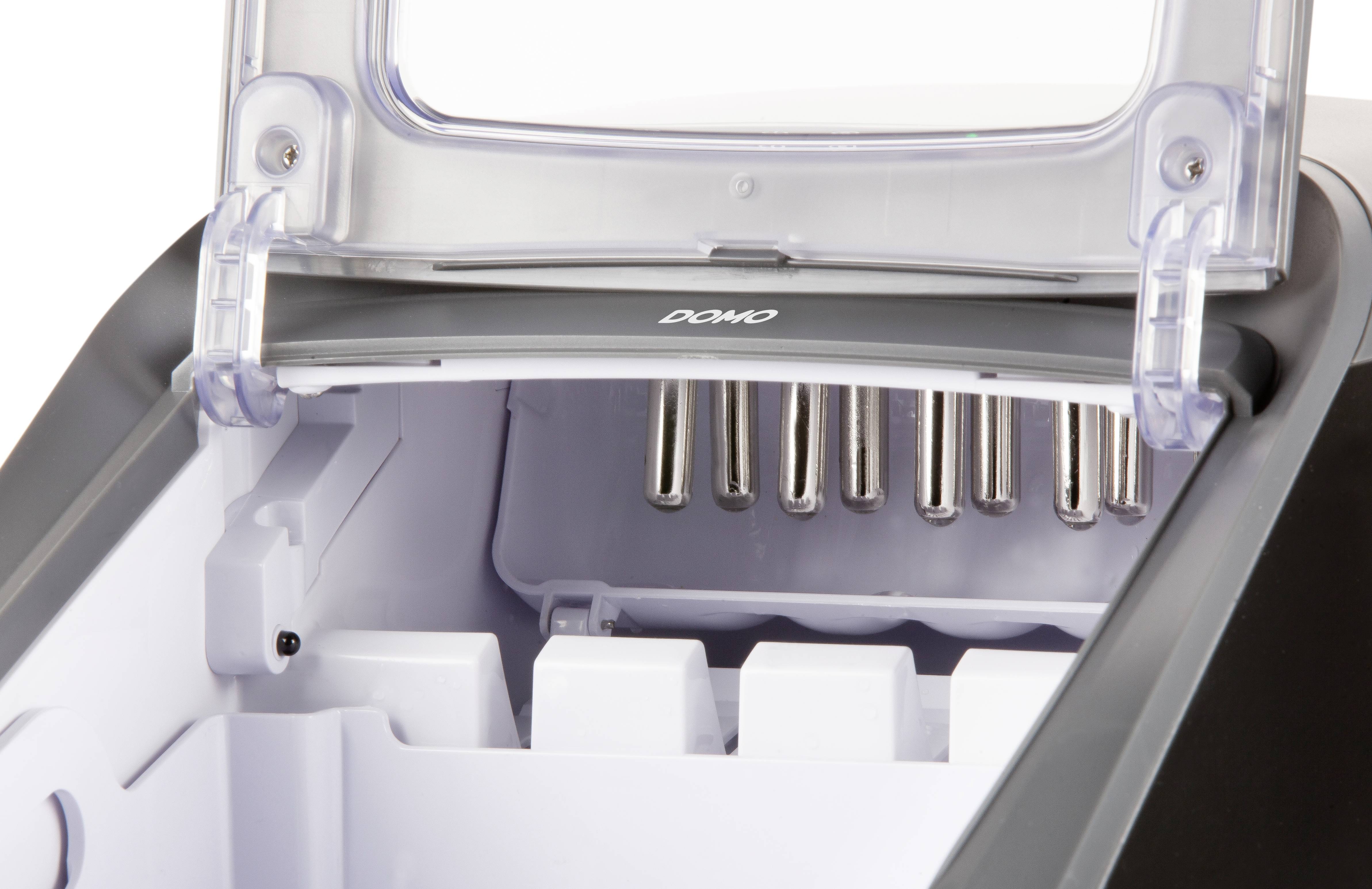 Eismaschine mit offenem Deckel, zeigt Eisherstellungsmechanismus.