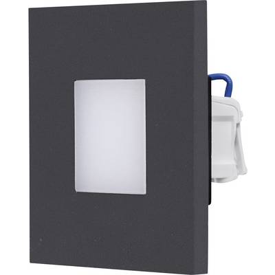 Schwarze rechteckige Wandabdeckung mit einer zentriert angebrachten weißen Schalterplatte und einem teilweise sichtbaren blau-weißen Elektrogerät dahinter.