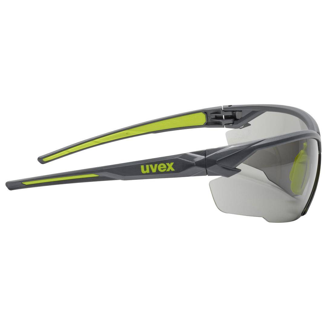 Sonnenbrille von Uvex in Grau und Gelb, seitliche Ansicht. Geeignet für Sport oder Outdoor-Aktivitäten mit UV-Schutz und modernem Design.