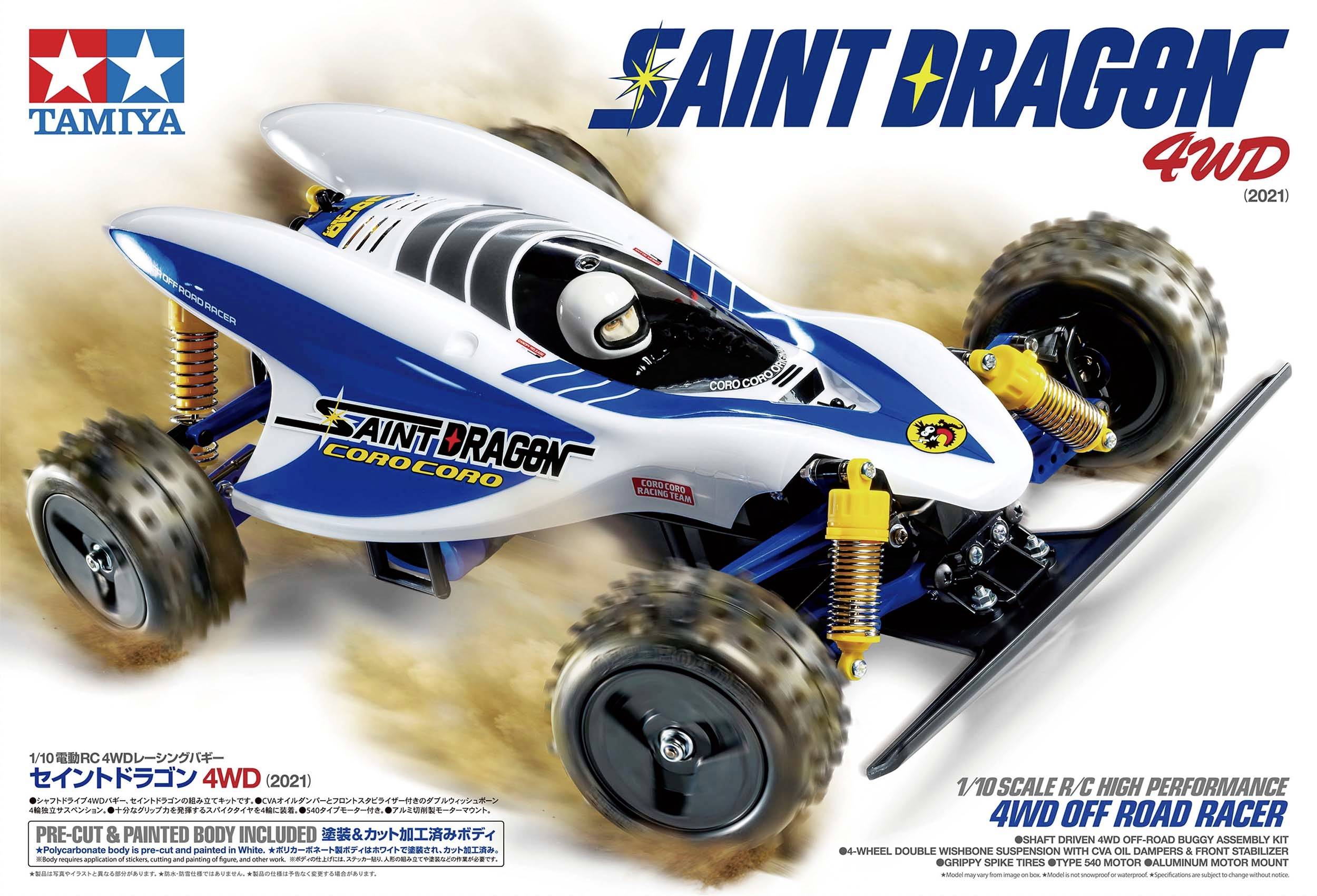 Rennspielzeugauto auf heller Verpackung. Text: 'Saint Dragon, 4WD, Tamiya'. Enthält ein weiß-blaues Off-Road-Modellauto mit robusten Reifen.