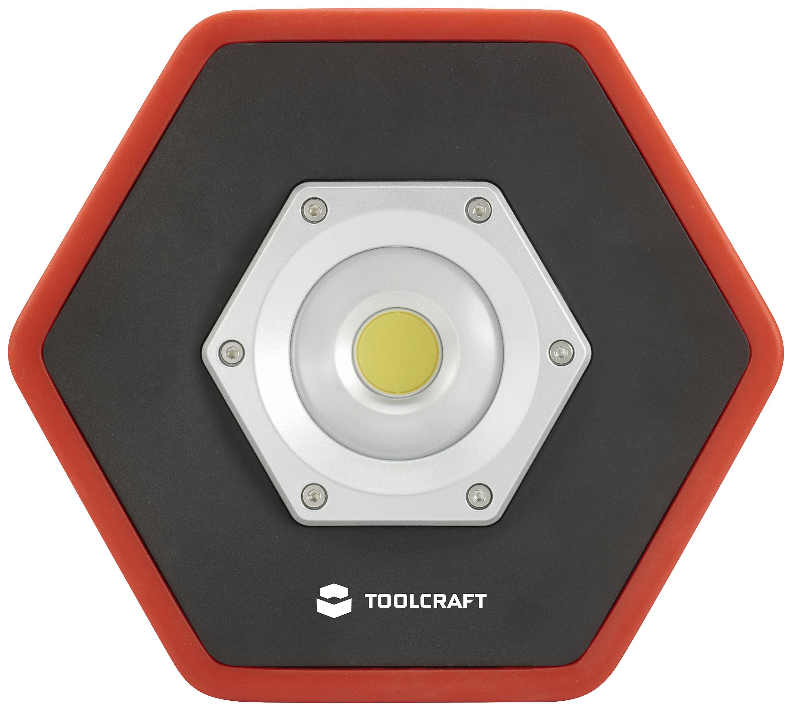Sechseckige Arbeitsleuchte mit zentralem LED-Licht, schwarzem Gehäuse und rotem Rand. Marke 'Toolcraft' in der unteren Mitte.