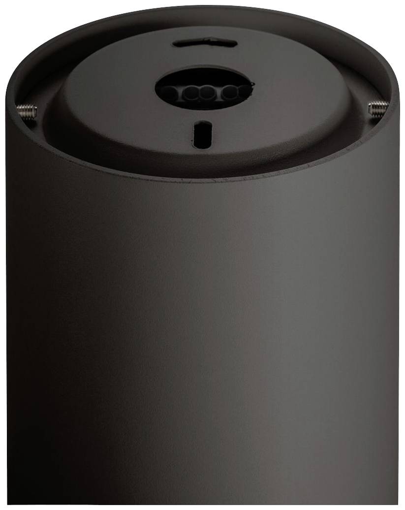 Eine schwarze zylinderförmige Vorrichtung mit sichtbarer Oberseite und einer Öffnung, wahrscheinlich ein technisches Gerät.