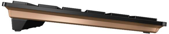 Seitenansicht einer modernen Computertastatur mit flachem, schwarzem Design und einer kupferfarbenen Basis.