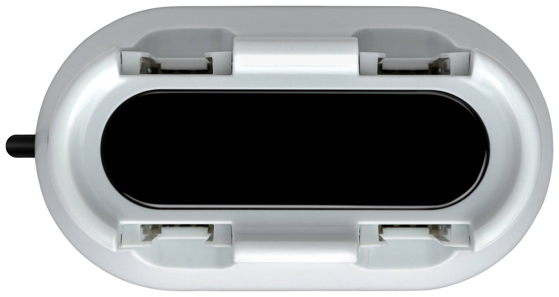 Ein ovaler, grauer Steckdosenadapter mit zwei Steckplätzen und einem schwarzen Zentrumsbereich, fotografiert von oben.