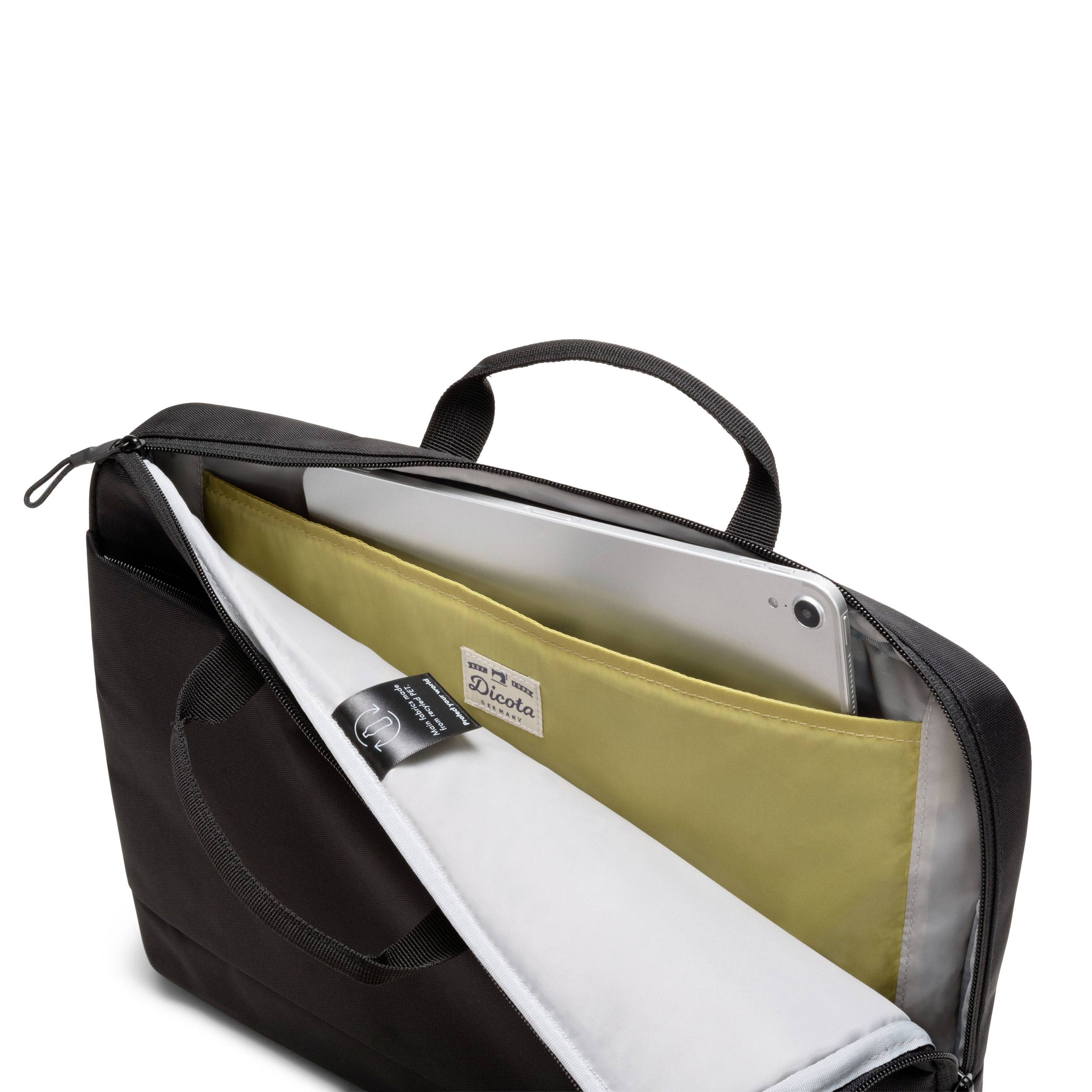 Eine geöffnete schwarze Laptoptasche zeigt einen Computer und ein gelbes Fach mit einem Buch darin.