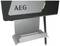 Ein schwarzes Gerät mit der Aufschrift 'AEG', beleuchtet durch ein grünes Lichtsignal. Es hat eine metallene Ablagefläche darunter.