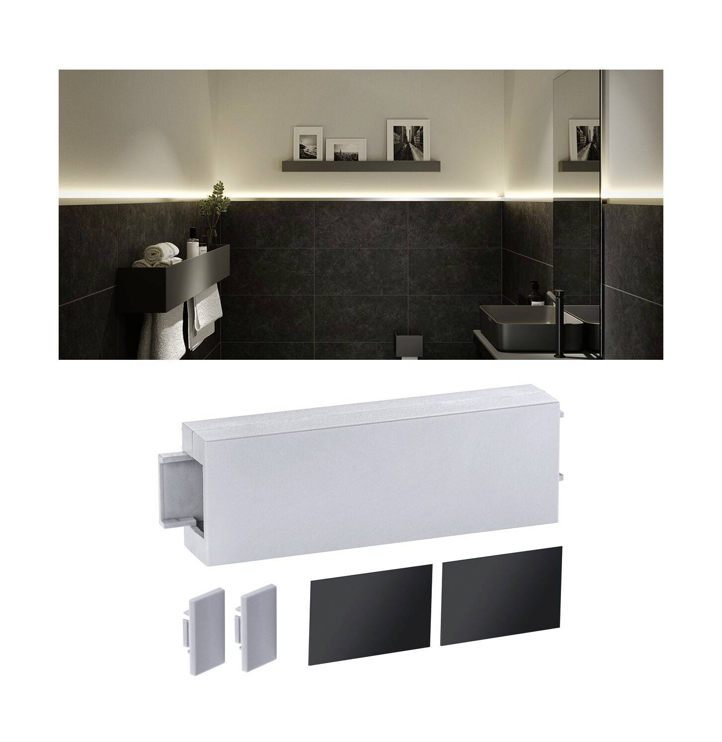 Modernes Badezimmer mit dunklen Fliesen, schwebendem Regal, beleuchtetem Spiegel, Handtüchern und Waschtisch; Anschlusskasten im Vordergrund.