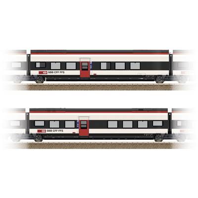 Zwei Modelleisenbahnwagen der SBB CFF FFS mit roten Türen und schwarzem Dach stehen auf einem Gleis.