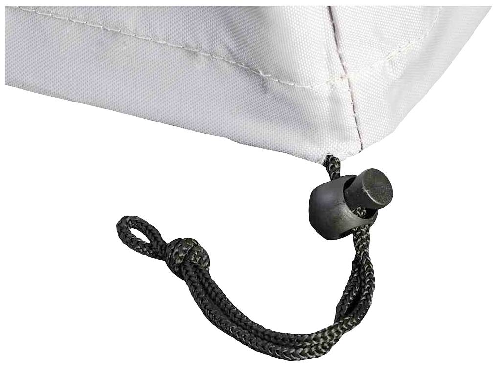Eine gespannte Kordel an der Ecke einer weißen Abdeckung mit einem schwarzen Kordelstopper.