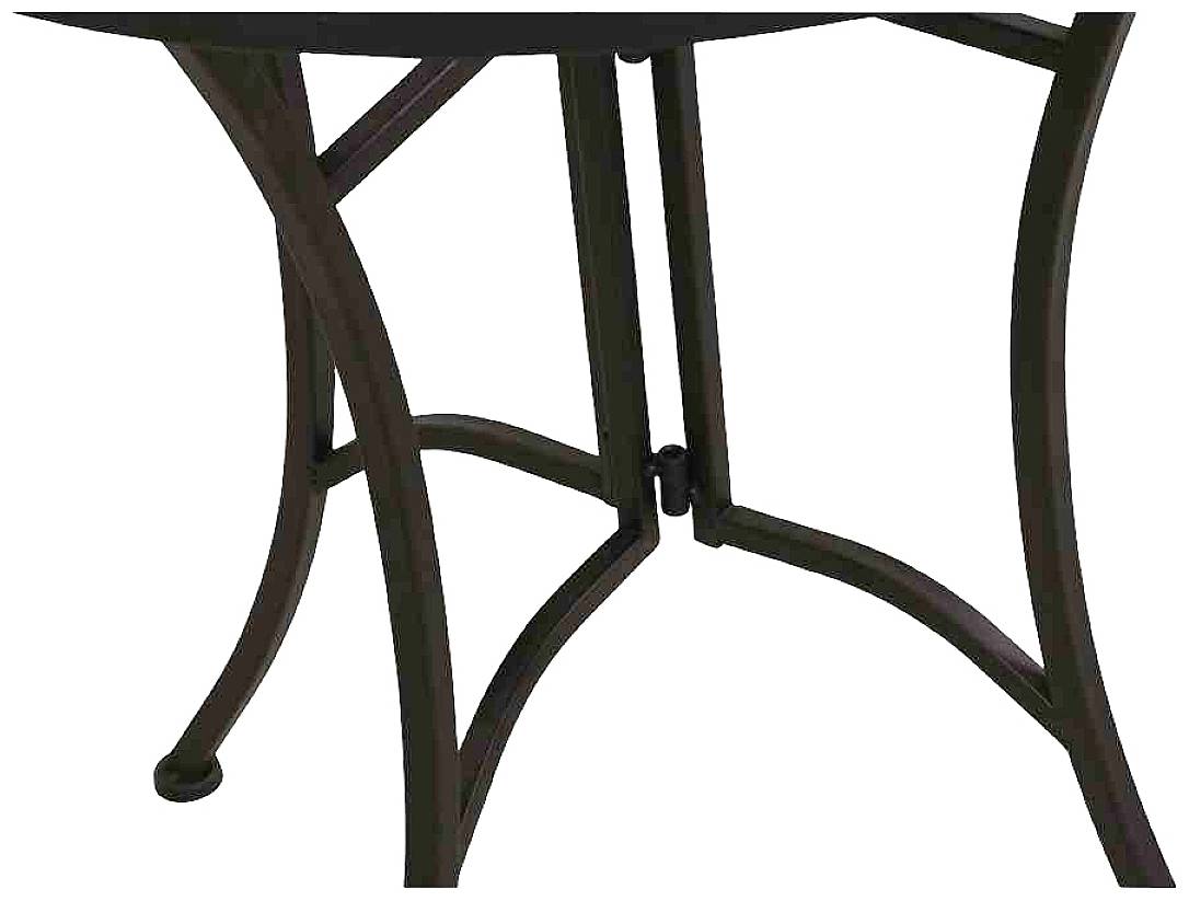 Ein Detailausschnitt von Tischbeinen aus dunklem Metall. Runde Formen und gebogene Linien verleihen ihnen ein elegantes Aussehen.