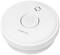 Runder, weißer Rauchmelder mit zentraler Taste und Lüftungsschlitzen.