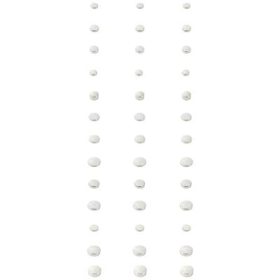 Tabletten in gleichmäßigen Abständen in vier vertikalen Reihen angeordnet.