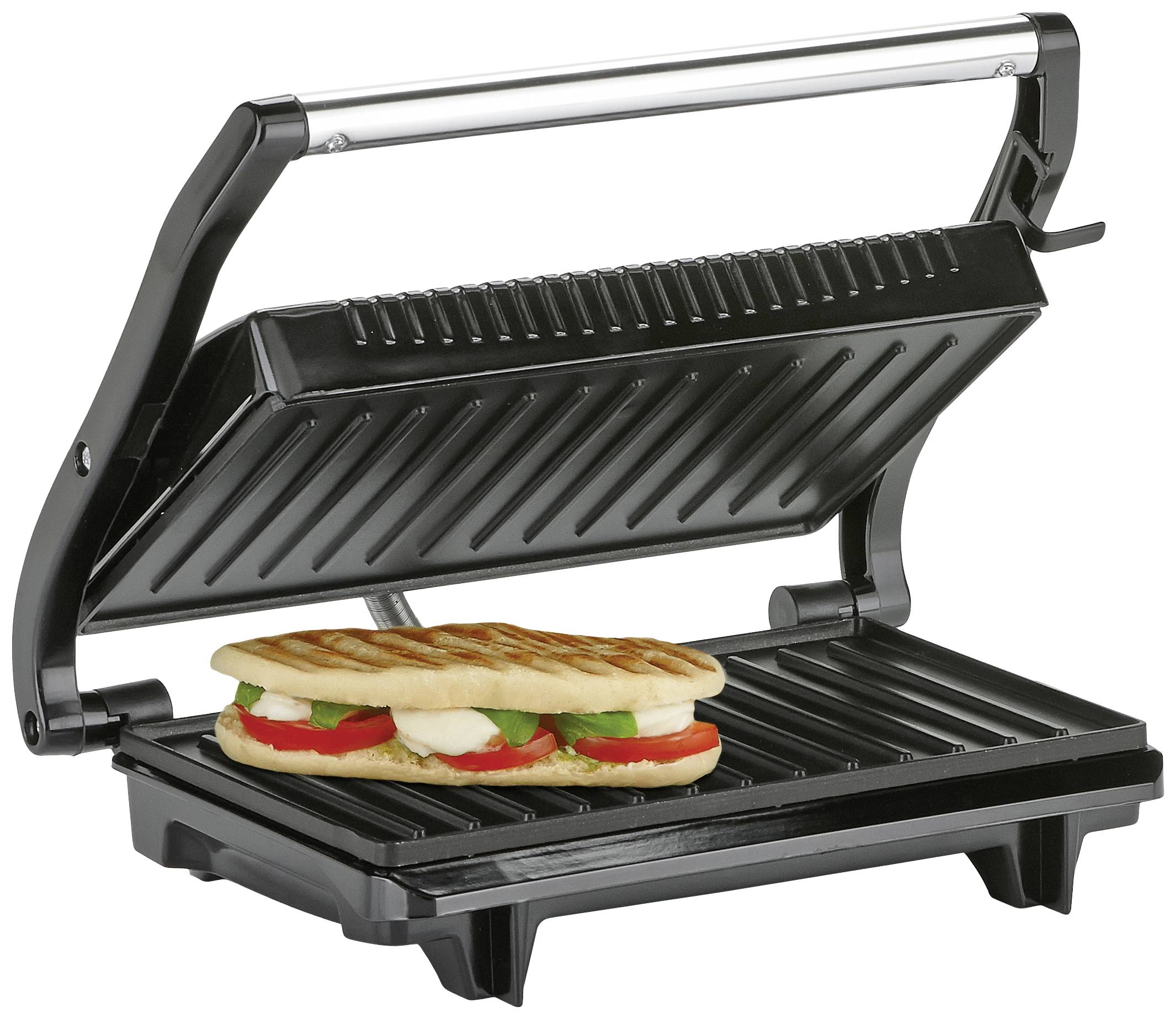 Ein elektrisches Panini-Grillgerät mit geöffnetem Deckel und einem gegrillten Panini-Sandwich mit Tomaten, Mozzarella und Basilikum.