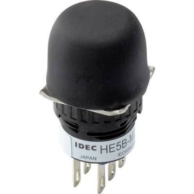 Ein schwarzer Drucktaster von IDEC mit Aufschrift 'HE5B'. Darunter steht 'JAPAN' und 'IEC60947'. Der Taster hat sechs Metallpins.