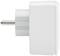 Ein weißer, rechteckiger Adapterstecker mit einem Metallstift, seitlich fotografiert.