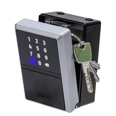 Schlüsselkasten mit elektronischem Zahlencode und einem Schlüsselbund im Schloss. Die Zahlen sind von 1 bis 9 angeordnet.