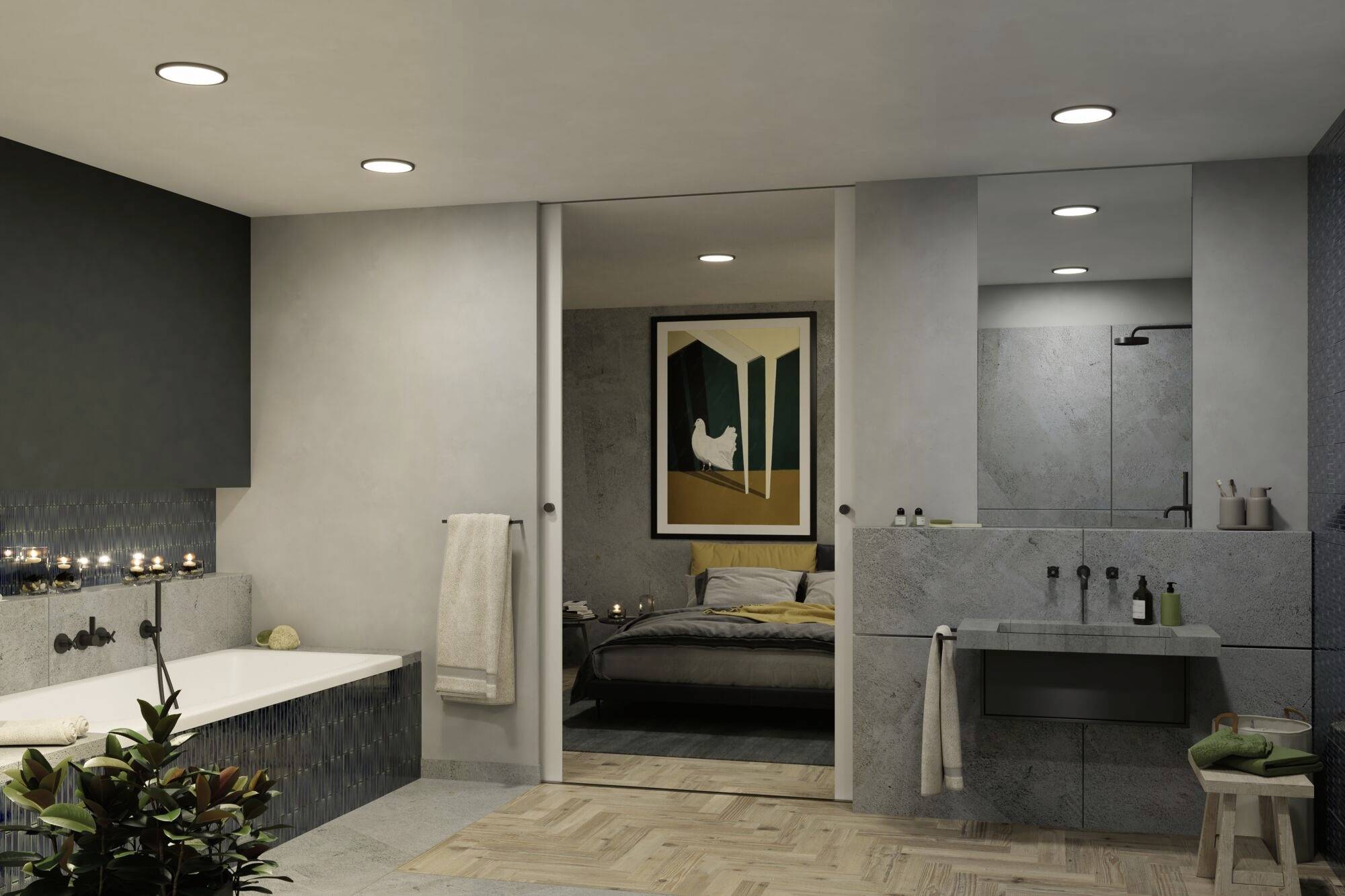 Modernes Badezimmer mit Badewanne, Waschbecken und Handtüchern. Im Hintergrund ein Schlafzimmer mit Gemälde an der Wand.