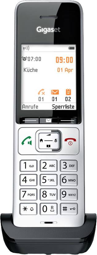 Schnurloses Telefon auf Basisstation, Anzeige zeigt Zeit 09:00 Uhr und Datum 01. April. Tasten für Anrufannahme und -ablehnung sichtbar.
