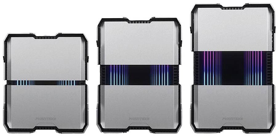 Drei silberne Computergehäuse mit schwarzen Kanten, mittig beleuchtete Rillen in Regenbogenfarben, nebeneinander aufgereiht.