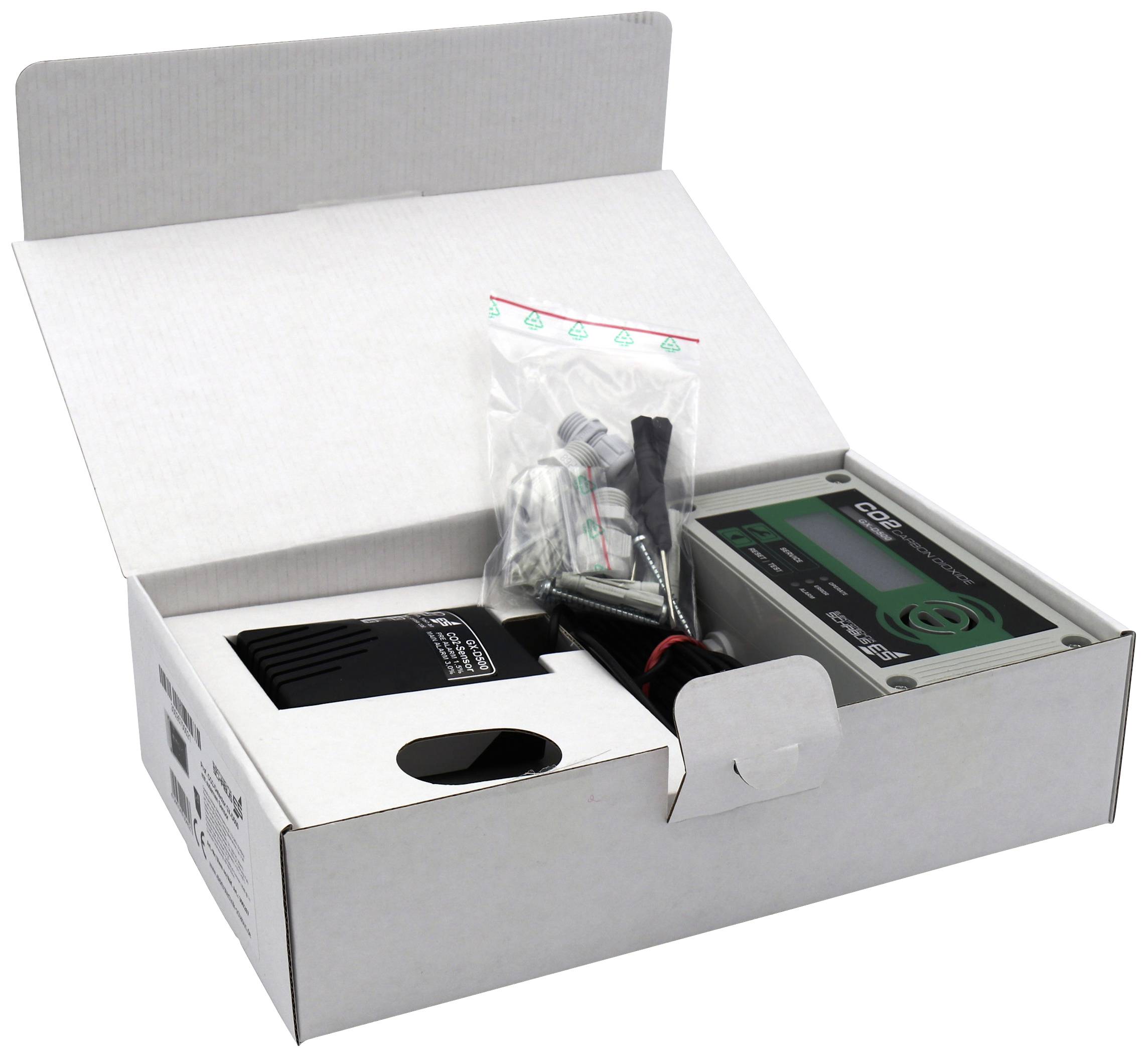 Eine geöffnete Verpackung zeigt ein elektronisches Gerät mit Zubehör, darunter Kabel und Befestigungselemente. Das Display zeigt 'CO2'.